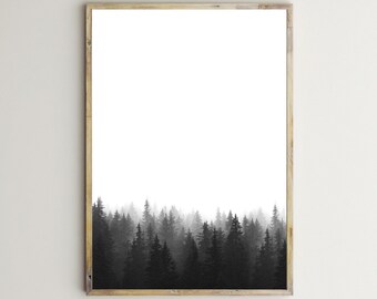 May include: A framed black and white print of a forest scene. The image shows a dense forest of tall trees at the bottom, fading into a misty white background. The frame is a light wood colour. Text at the bottom reads "by beguima - Instant Download Art - On Etsy - For Personal Use Only."