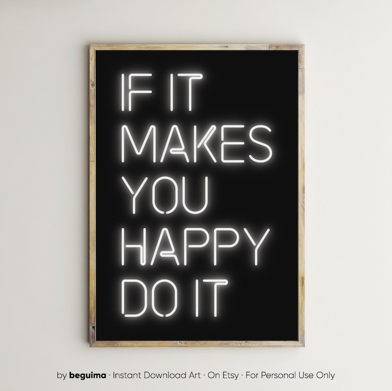 May include: A framed art print with a black background and white neon-style text that reads "IF IT MAKES YOU HAPPY DO IT." The frame is a light brown color.