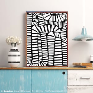 May include: Abstract black and white art print in a wooden frame. The artwork features a geometric design with curved and straight lines. A striped vase with white flowers sits on a blue cabinet. The text "by beguima" is at the bottom.