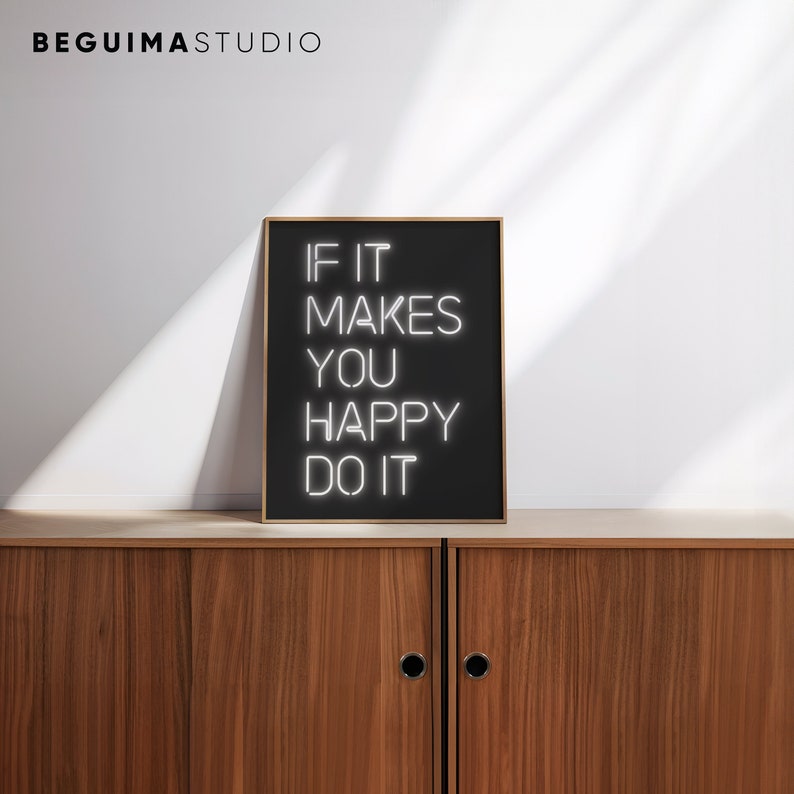 May include: A framed black sign with the text "IF IT MAKES YOU HAPPY DO IT" in white neon-style lettering. The sign is displayed on a wooden cabinet. The top left corner of the image has the text "BEGUIMA STUDIO".