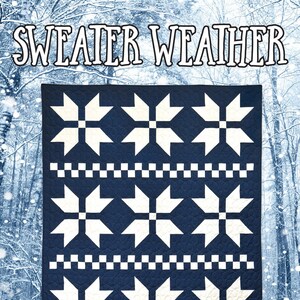 May include: A navy blue quilt with a white snowflake pattern and the text "SWEATER WEATHER." The quilt features a repeating design of white snowflakes and a checkered border. The Running Doe Quilts logo is at the bottom.