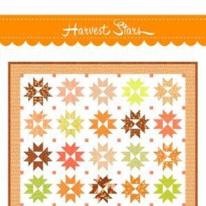 May include: Harvest Stars quilt pattern featuring a patchwork design of orange, brown, yellow, and green stars on a white background. The pattern is labeled "Layer Cake Friendly" and is by Fig Tree & Co.
