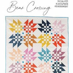 May include: A quilt pattern called "Bear Crossing" by Love Sew Modern. The pattern features a colorful patchwork design with a variety of geometric shapes and patterns. The quilt is available in baby, throw, and bed sizes.