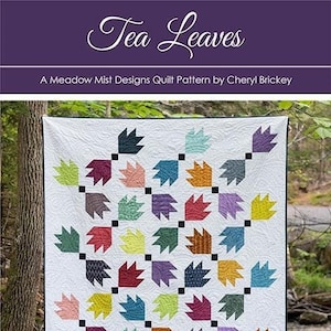May include: A quilt pattern called "Tea Leaves" by Meadow Mist Designs. The pattern features a colorful design of leaves in a white background. The pattern is available in baby, throw, twin, and queen sizes.