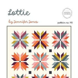 May include: A quilt pattern titled "Lottie" by Jennifer Jones. The design features a grid of colorful starburst patterns in shades of orange, pink, teal, and purple on a cream background. The pattern is suitable for pillows, toddler blankets, throws, and beds.