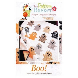 May include: A white quilt with appliqued ghost designs in orange, gray, black, and tan. The quilt features the text "Boo!" and the website address www.thepatternbasket.com. The Pattern Basket logo is at the top.