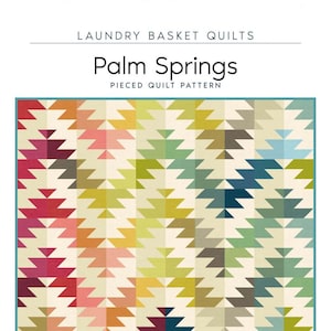 May include: A quilt pattern called "Palm Springs" with a geometric design featuring a variety of colors, including red, orange, yellow, green, blue, and brown. The quilt is 60 1/2 inches by 72 1/2 inches.