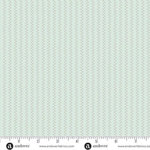 May include: A light blue fabric with a repeating pattern of thin, wavy lines in a lighter shade of blue. The fabric has a ruler along the bottom edge, with the Andover Fabrics logo and website address.