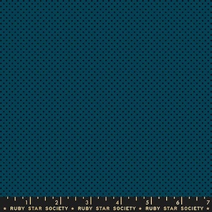 May include: Teal fabric with a repeating pattern of small, dark blue dots. The fabric has a smooth texture and a consistent color throughout. The bottom of the image shows a ruler with the text "RUBY STAR SOCIETY".