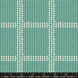 May include: Teal fabric with a dotted pattern and a grid design. The grid lines are made of white dots. The fabric has a ruler at the bottom with the text "RUBY STAR SOCIETY".