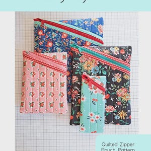 May include: Four quilted zipper pouches in various floral patterns, including a pink strawberry print and a blue floral design. Each pouch has a contrasting zipper and is labeled as the "Hemingway Pouch". The image also includes text that says "Quilted Zipper Pouch Pattern in Four Sizes."