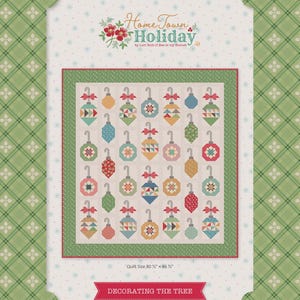 May include: A quilt with a festive Christmas theme, featuring colorful ornament designs. The quilt is bordered with green and red accents, and the text "Home Town Holiday" is displayed at the top. The quilt size is 80.5" x 86.5". The words "Decorating the Tree" are at the bottom.