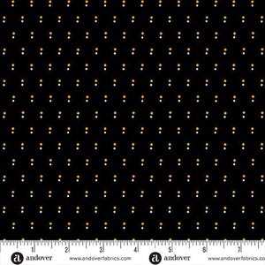 May include: Black fabric with a repeating pattern of small white and gold dots. The dots are evenly spaced across the surface. The fabric has a ruler along the bottom edge with the brand name "andover" printed on it.