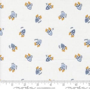 May include: White fabric with a repeating pattern of yellow flowers and blue heart-shaped vases. The vases are filled with yellow flowers and surrounded by small green leaves. The fabric has a ruler along the bottom edge.