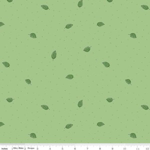 May include: A green fabric with a repeating pattern of small green leaves. The fabric has a subtle speckled texture.