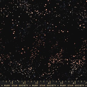 May include: Black fabric with a speckled pattern in shades of copper, gray, and white. The fabric has a dark background with a constellation-like design. The text "RUBY STAR SOCIETY" is at the bottom.