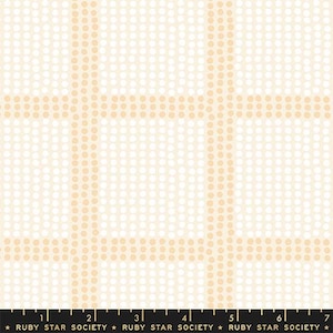 May include: Cream-colored fabric with a grid pattern formed by rows of white and light orange dots. The dots are evenly spaced, creating a textured effect. The bottom of the image has a black ruler with the text "RUBY STAR SOCIETY".
