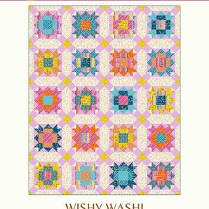 May include: A colorful quilt pattern titled "Wishy Washi" by Copper Kettle Quilt Company. The design features repeating starburst blocks in shades of blue, orange, pink, and yellow, set against a cream background. The quilt is available in runner, baby, and throw sizes.