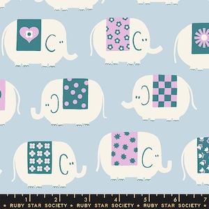 May include: A light blue fabric with a repeating pattern of white elephants wearing different colored and patterned blankets. The elephants have teal eyes and a small smile. The blankets have patterns of flowers, polka dots, checkered squares, and stars.