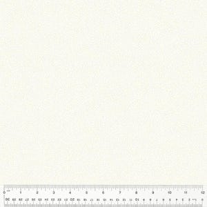 May include: Cream-colored fabric with a subtle, textured pattern. A ruler with inch and centimeter markings is at the bottom, showing measurements up to 12 inches and 30 centimeters.