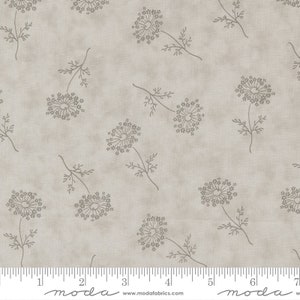 May include: A beige fabric with a repeating pattern of gray stylized dandelion flowers. The fabric has a subtle texture and a light gray background.