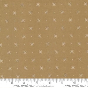 May include: A beige fabric with a white crosshatch pattern. The fabric has a subtle texture and is perfect for quilting, sewing, and crafting.