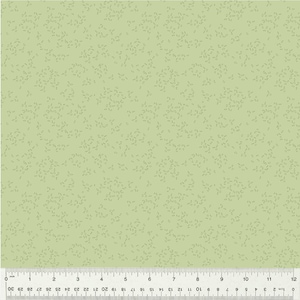 May include: Light green fabric with a subtle pattern of small, light green leaf shapes. The fabric has a ruler along the bottom edge, marked in inches and centimeters, showing a 12-inch width.