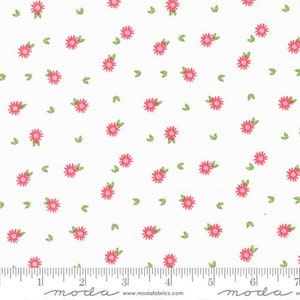 May include: White fabric with a repeating pattern of small pink flowers and green leaves.