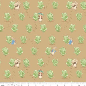 May include: Fabric with a repeating pattern featuring illustrations of rabbits, lettuce, and footprints on a tan background. The rabbits are depicted in various poses, some wearing blue jackets. The lettuce is green.