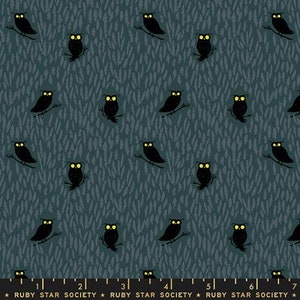 May include: A blue fabric with a repeating pattern of black owls with yellow eyes. The owls are facing different directions and are set against a blue background with a subtle pattern of white lines.