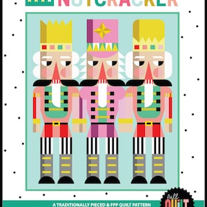May include: A colorful quilt pattern featuring three stylized nutcracker figures in pink, red, and yellow. The text "SON OF A NUTCRACKER" is displayed above the figures. The finished size is 71" x 89".