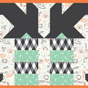 May include: A Halloween-themed fabric panel with a repeating pattern of geometric shapes and spooky motifs. The design features black, orange, gray, and mint green elements on a cream background, framed by an orange border. The panel includes triangles, diamonds, and stylized witch hat shapes.