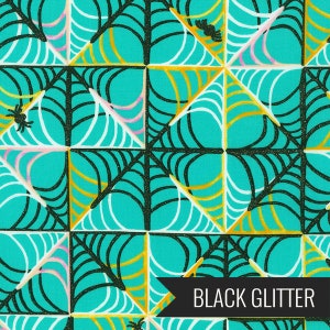 May include: A teal blue background with a repeating pattern of black spiderwebs with gold and white accents. The text "BLACK GLITTER" is at the bottom of the image.