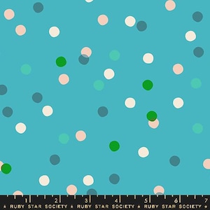 May include: A turquoise blue fabric with a repeating pattern of white, pink, and green polka dots. The fabric is printed with the text "RUBY STAR SOCIETY" in gold.