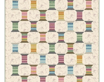 May include: A quilt pattern for a spool quilt called "Variegated Thread". The pattern features a grid of colorful spools of thread on a white background with a floral pattern. The quilt measures 51 1/2 inches by 60 1/2 inches.