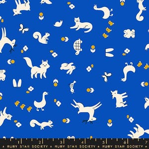 May include: A blue fabric with a white repeating pattern of animals, flowers, and geometric shapes. The animals include a fox, squirrel, deer, rabbit, goose, cat, and frog. The flowers are yellow and the geometric shapes are white.