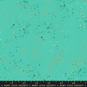 May include: A turquoise fabric with a speckled pattern. The fabric features a teal background with scattered dots in shades of teal, gold, and white. The words "RUBY STAR SOCIETY" are printed at the bottom.