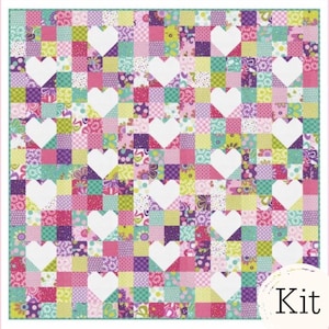 May include: A colorful patchwork quilt featuring a repeating pattern of white hearts on a background of various floral and geometric patterned squares in shades of pink, purple, green, and blue. The quilt has a light green border and the word "Kit" in the lower right corner.