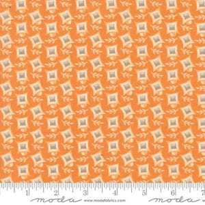 May include: Orange fabric with a repeating pattern of square shapes and small floral accents. The squares have a lighter, textured center and a darker border. The fabric is marked with a ruler and the word "moda".