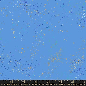 May include: Blue fabric with a scattered pattern of gold and blue dots. The fabric has a subtle shimmer.