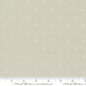May include: A light gray fabric with a white cross stitch pattern. The fabric is textured and has a subtle sheen. The fabric is shown with a ruler in inches.