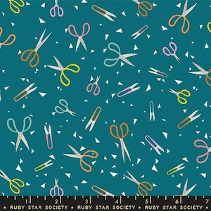 May include: Teal fabric with a repeating pattern of scissors in various colors, including orange, yellow, pink, and teal. White triangle shapes are scattered throughout the design. The text "RUBY STAR SOCIETY" is at the bottom.