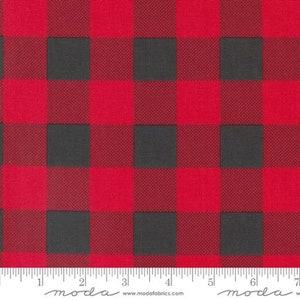 May include: Red and black buffalo plaid fabric. The fabric has a woven texture and is perfect for quilting, crafts, and home decor projects.