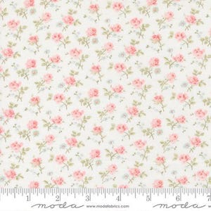 May include: Floral fabric with a repeating pattern of pink roses, small blue flowers, and green leaves on a cream background. The fabric has a vintage, cottagecore aesthetic, perfect for quilting or sewing projects.