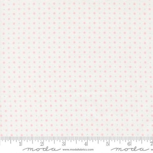 May include: White fabric with a repeating pattern of pink and gray polka dots. The dots are evenly spaced across the surface. A ruler is at the bottom of the fabric, with the word "moda" printed on it.