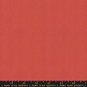 May include: Solid red fabric with a subtle texture. The fabric is a solid color with a slight sheen.