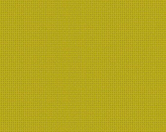 Puede incluir: Primer plano de una tela texturizada de color chartreuse con un patrón de cuadrícula. La tela es de color liso y parece ser un material tejido. Una regla está en la parte inferior de la imagen, con medidas en centímetros.