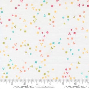 May include: White fabric with a scattered floral pattern in shades of pink, yellow, green, and blue. The flowers are small and delicate, creating a cheerful and whimsical design. The fabric has a subtle texture.