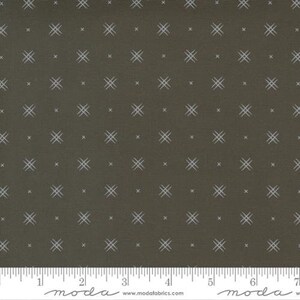 May include: A brown fabric with a white crosshatch pattern. The fabric is a quilting cotton and is perfect for crafting projects.