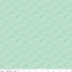 May include: A seamless fabric pattern in shades of mint green. The design features overlapping, semi-circular shapes creating a textured, geometric effect. The fabric is measured in inches, with the Riley Blake Designs logo visible.